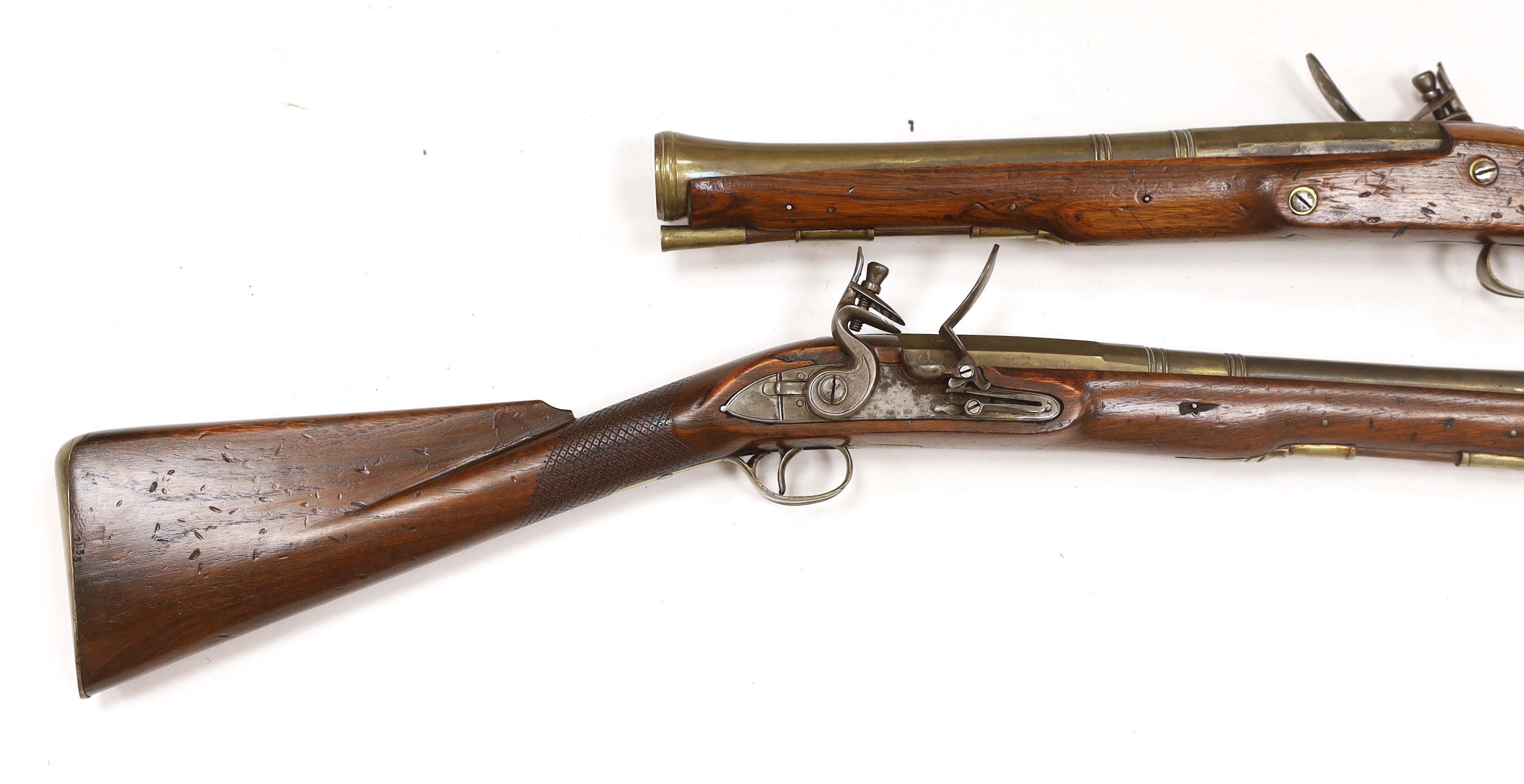 A pair of reproduction 'York Mail' flintlock blunderbusses in a late 18th century style.